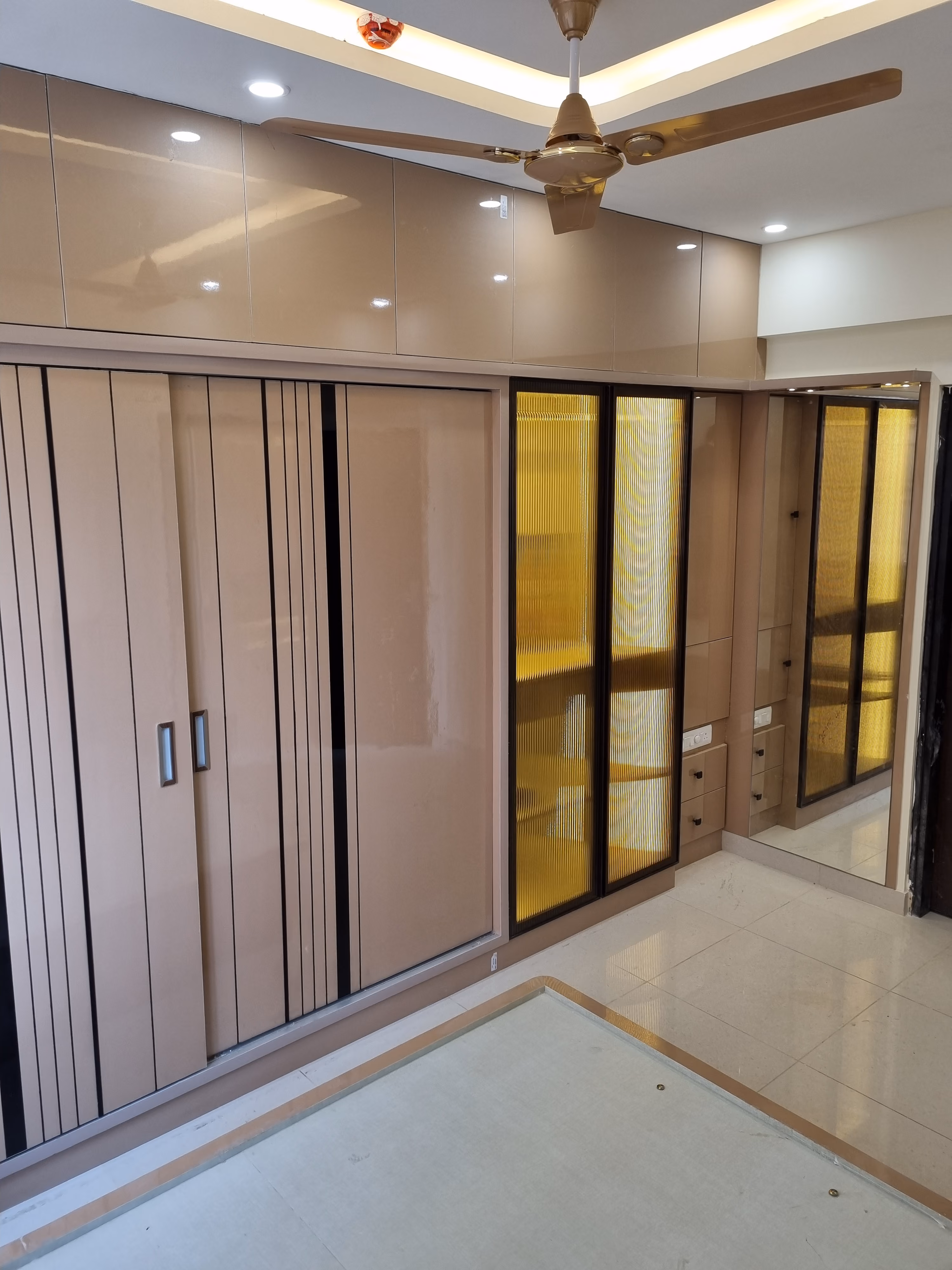 Custom wardrobe with glossy finish in a Bangalore apartment