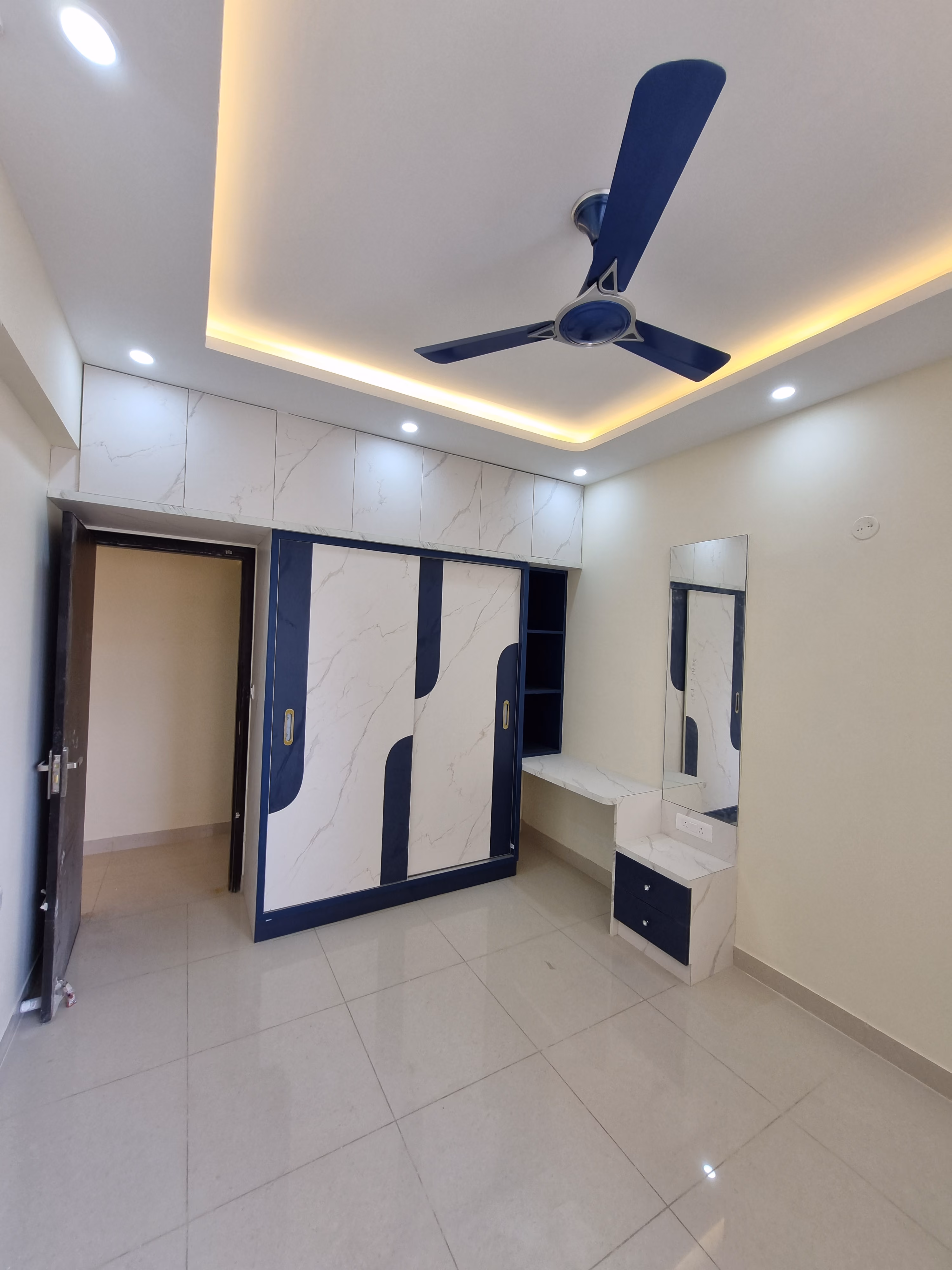 Navy and white wardrobe with an integrated dressing table